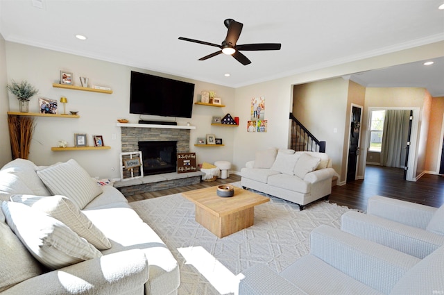 6357 Spirea Ct, West Lafayette, IN 47906 - living area with ornamental molding, stairs, a ceiling fan, and wood finished floors