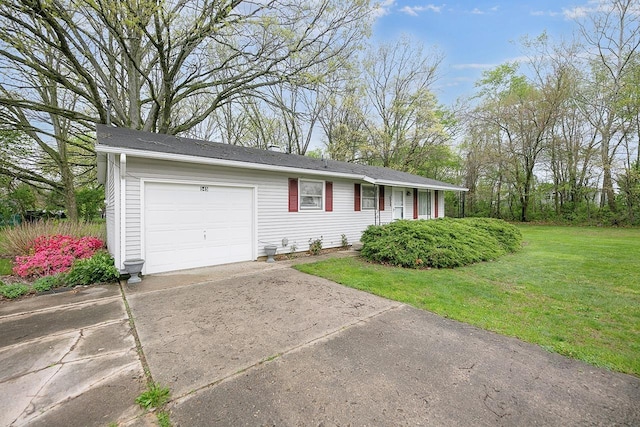 ranch-style home featuring a garage, a front lawn, and driveway