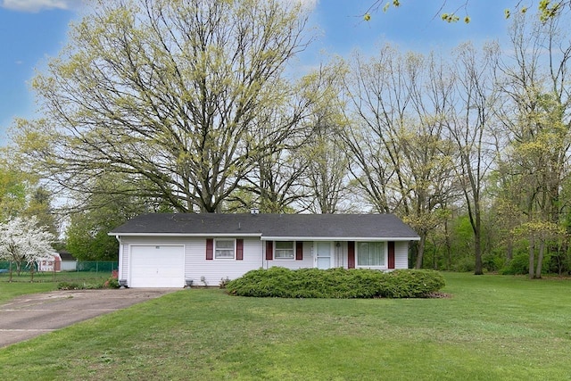ranch-style home featuring aphalt driveway, a garage, and a front lawn
