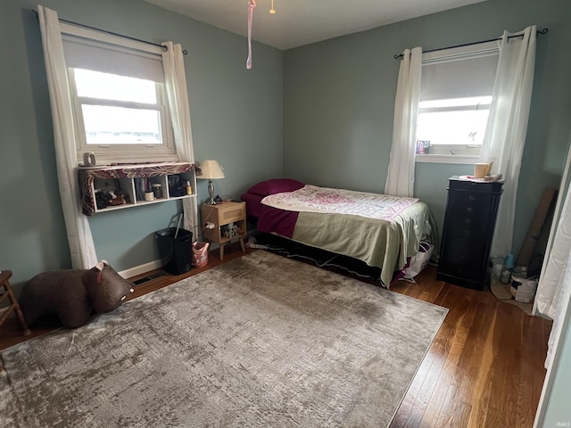 bedroom featuring wood finished floors