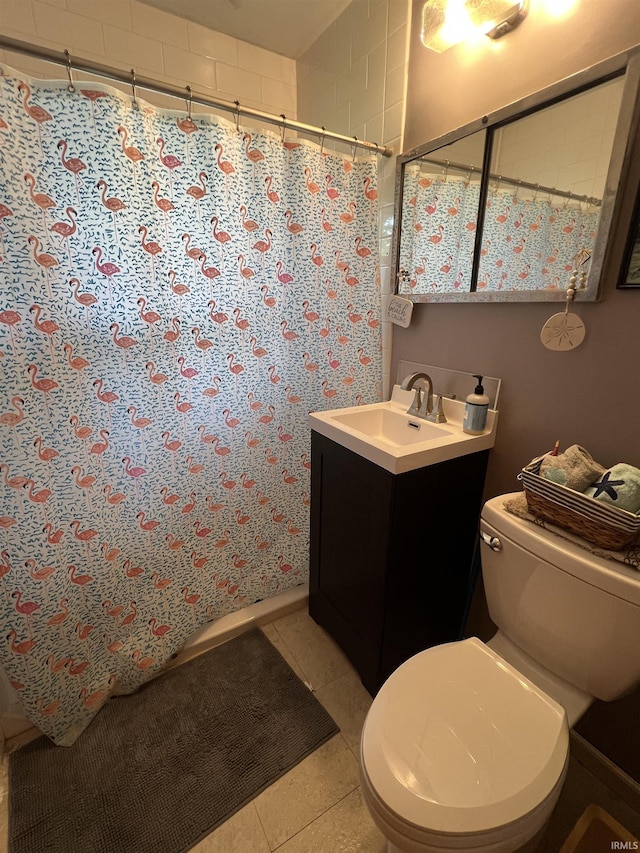 full bathroom featuring curtained shower, vanity, toilet, and tile patterned flooring