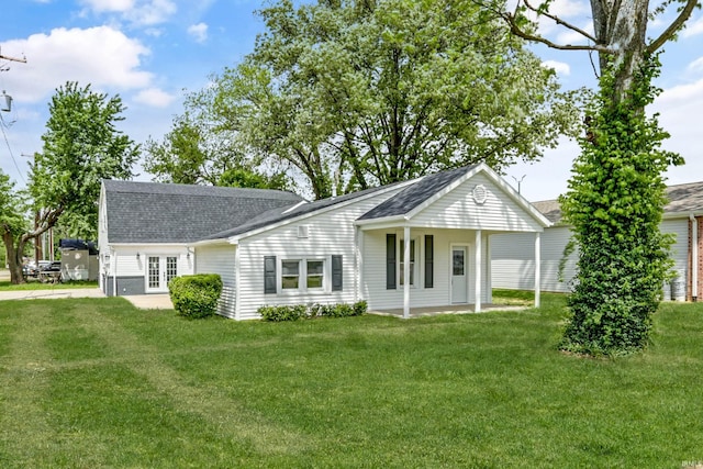 615 Washington St, Rockport, IN 47635 - view of front of home with a shingled roof, french doors, and a front yard