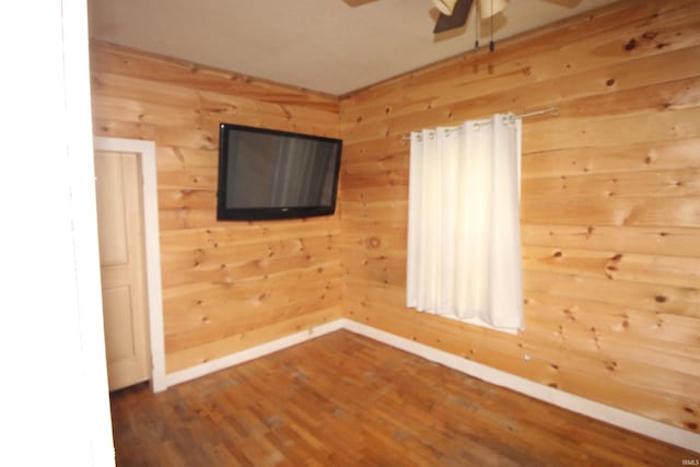 29623 County Road 6th Rd, Elkhart, IN 46514 - unfurnished room featuring a ceiling fan, wood finished floors, baseboards, and wood walls