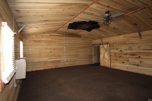 29623 County Road 6th Rd, Elkhart, IN 46514 - additional living space featuring a barn door, wood walls, lofted ceiling, wooden ceiling, and carpet flooring