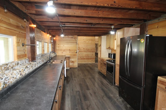 29623 County Road 6th Rd, Elkhart, IN 46514 - kitchen with appliances with stainless steel finishes, a sink, light brown cabinetry, dark wood-type flooring, and wooden walls