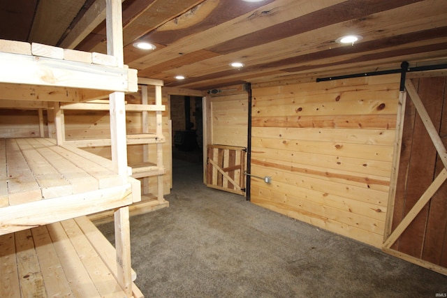 29623 County Road 6th Rd, Elkhart, IN 46514 - basement featuring recessed lighting, carpet, wooden walls, and a barn door