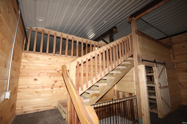 29623 County Road 6th Rd, Elkhart, IN 46514 - staircase featuring a barn door and wooden walls