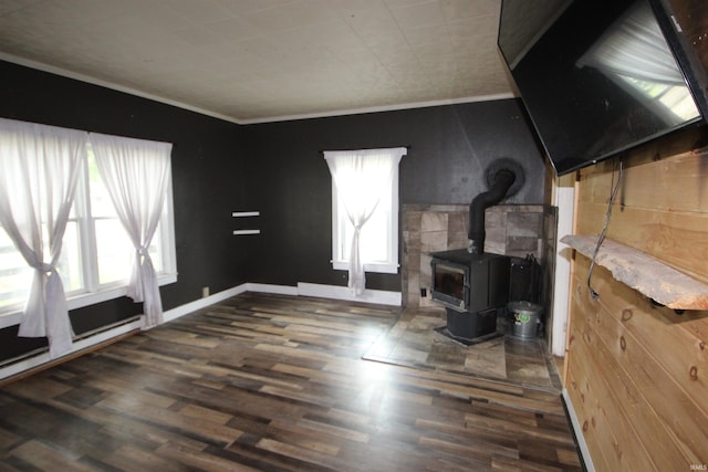 29623 County Road 6th Rd, Elkhart, IN 46514 - unfurnished living room with a wood stove, wood finished floors, a baseboard heating unit, and baseboards