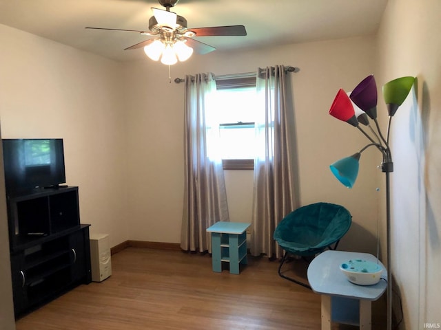 interior space with light wood-style floors and a ceiling fan