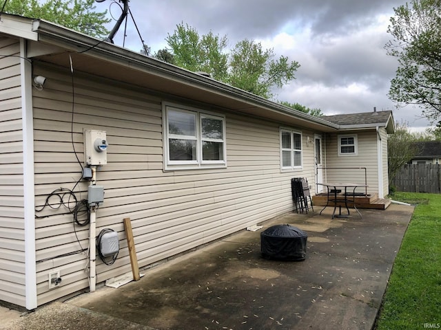 back of house with a patio area and a fire pit