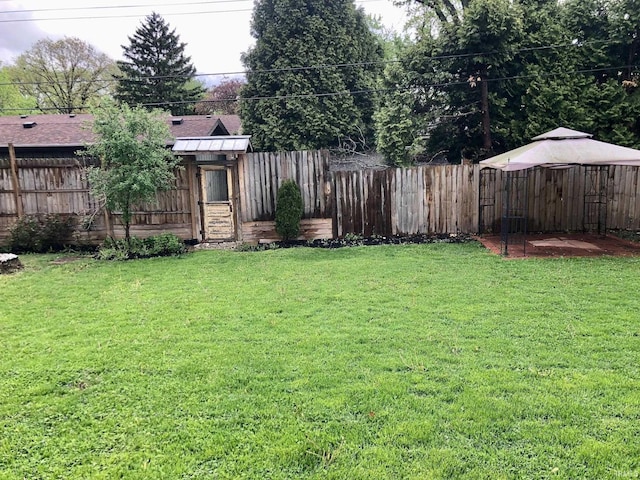 view of yard featuring a gazebo and fence