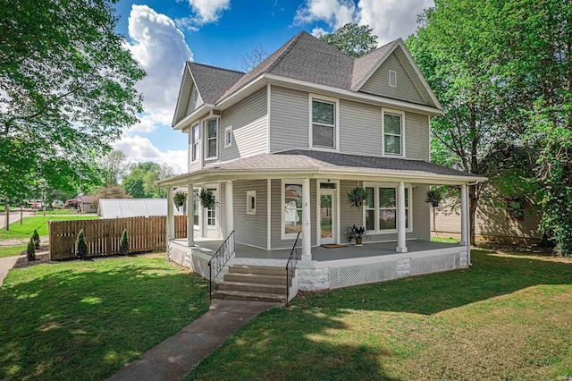 108 S Church St, Owensville, IN 47665 - victorian-style house featuring a porch, roof with shingles, fence, and a front yard