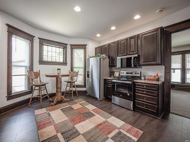 108 S Church St, Owensville, IN 47665 - kitchen with recessed lighting, backsplash, dark wood-style floors, dark brown cabinets, and appliances with stainless steel finishes