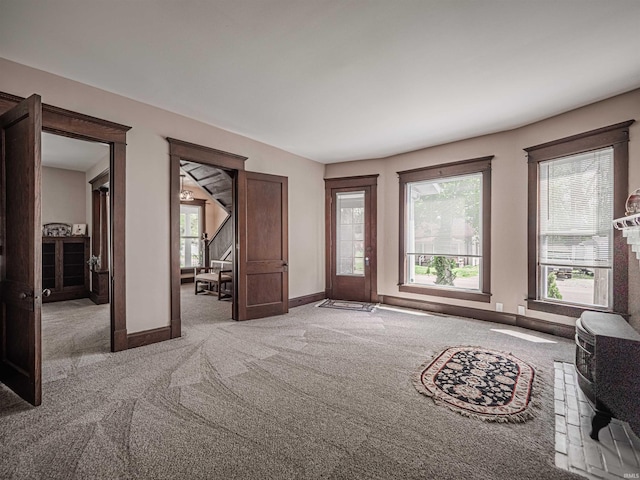 108 S Church St, Owensville, IN 47665 - unfurnished living room featuring light colored carpet and baseboards