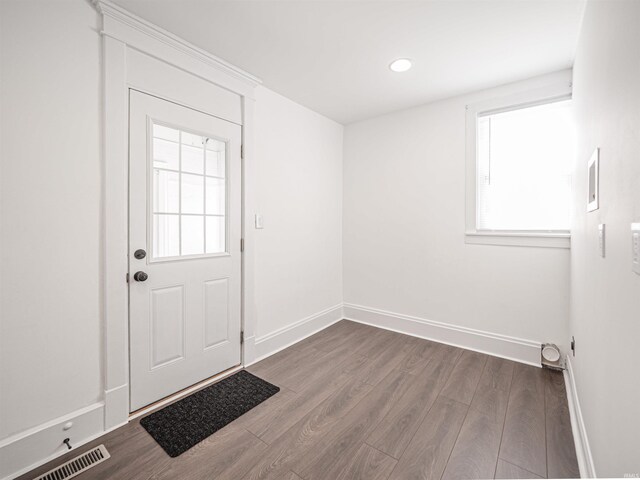108 S Church St, Owensville, IN 47665 - doorway featuring baseboards, a healthy amount of sunlight, visible vents, and wood finished floors
