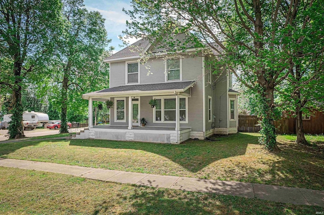 108 S Church St, Owensville, IN 47665 - view of front of property featuring a porch, a front lawn, and fence