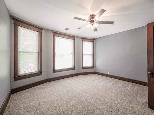 108 S Church St, Owensville, IN 47665 - carpeted spare room featuring plenty of natural light, visible vents, baseboards, and a ceiling fan