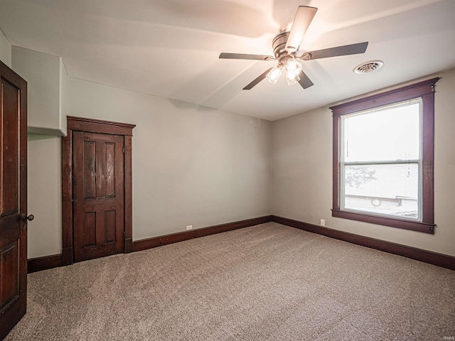 108 S Church St, Owensville, IN 47665 - empty room featuring ceiling fan, carpet floors, baseboards, and visible vents