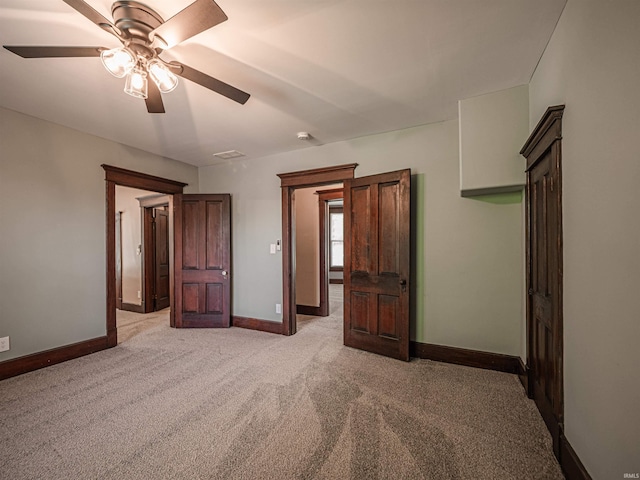 108 S Church St, Owensville, IN 47665 - unfurnished bedroom featuring light colored carpet, baseboards, and a ceiling fan