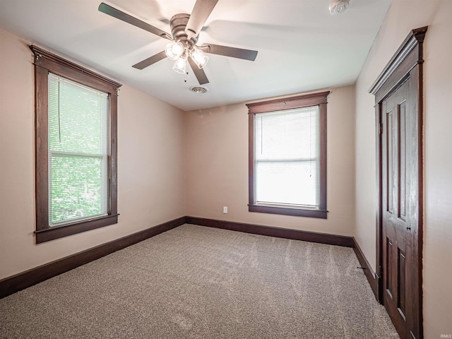 108 S Church St, Owensville, IN 47665 - interior space featuring baseboards, multiple windows, and carpet floors