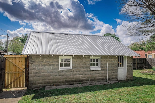 108 S Church St, Owensville, IN 47665 - rear view of property with a gate, fence, metal roof, and a lawn