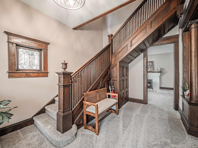 108 S Church St, Owensville, IN 47665 - stairway featuring carpet flooring, baseboards, and a glass covered fireplace