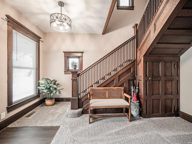 108 S Church St, Owensville, IN 47665 - carpeted foyer with a chandelier, stairs, a wealth of natural light, and baseboards