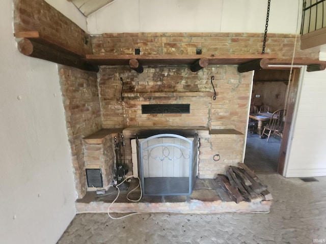 details featuring a fireplace, carpet floors, and visible vents