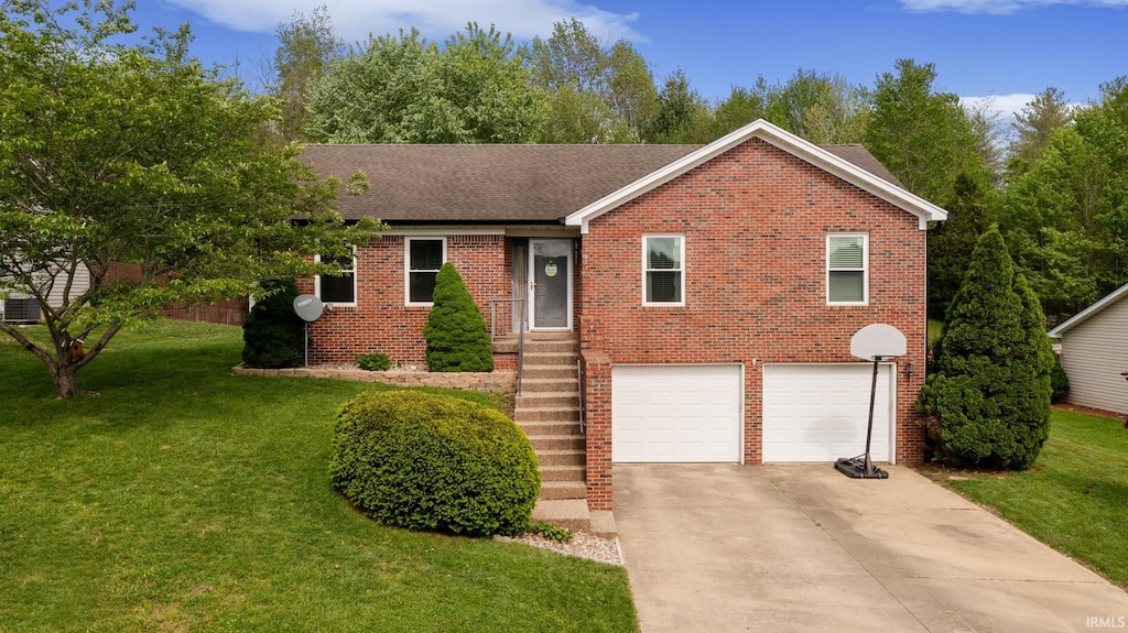 ranch-style home featuring an attached garage, brick siding, driveway, and a front yard
