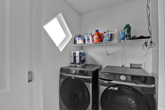 laundry room featuring washer and dryer and laundry area