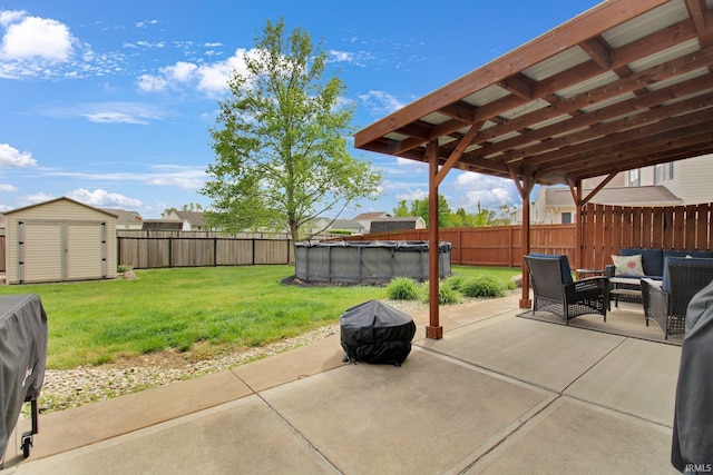 view of patio with an outdoor living space, a fenced in pool, a fenced backyard, and a storage unit