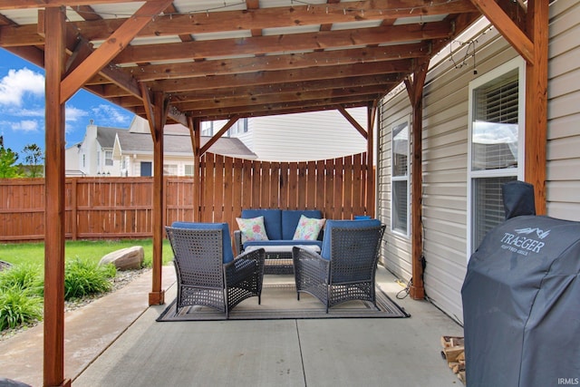 view of patio / terrace featuring area for grilling, a fenced backyard, and an outdoor living space