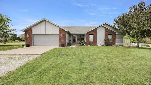 view of front facade with concrete driveway, an attached garage, a front lawn, and brick siding