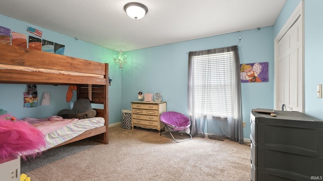 carpeted bedroom with baseboards