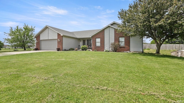 view of front facade featuring driveway, brick siding, fence, a garage, and a front yard