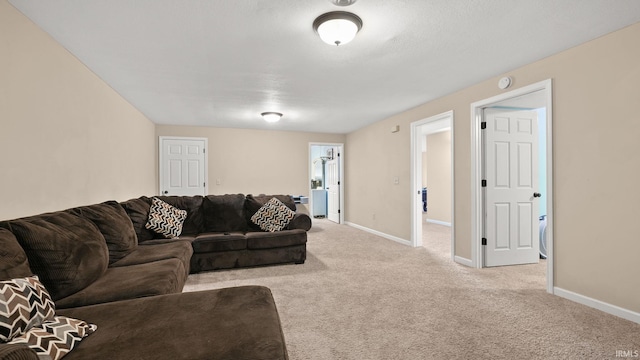 living room with baseboards and carpet