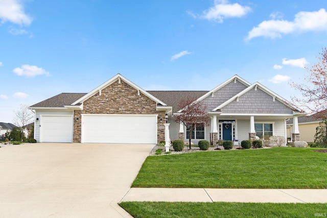craftsman house featuring driveway, a garage, stone siding, and a front yard
