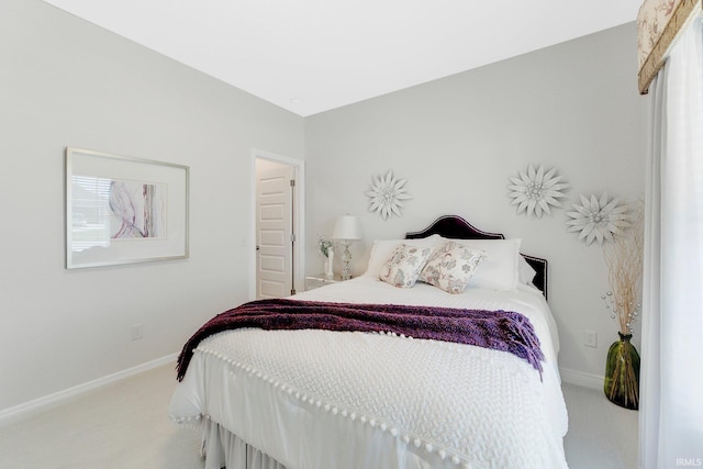 carpeted bedroom with baseboards