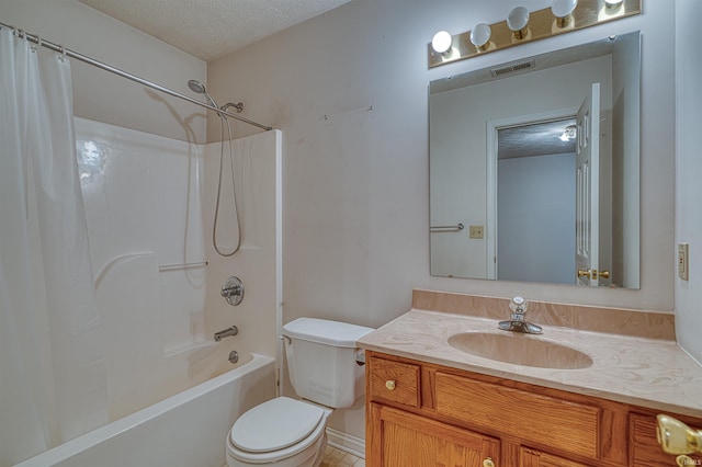 bathroom with toilet, vanity, shower / tub combo with curtain, a textured ceiling, and visible vents