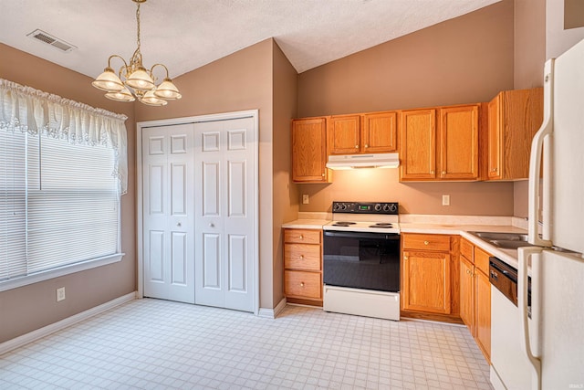 kitchen featuring visible vents, white appliances, under cabinet range hood, light countertops, and a chandelier