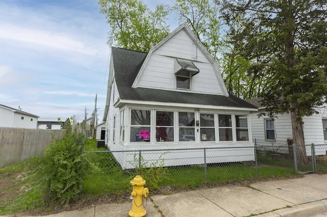 1116 Christyann St, Mishawaka, IN 46545 - back of house featuring a shingled roof and a fenced front yard