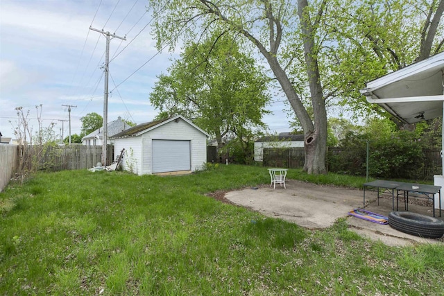 1116 Christyann St, Mishawaka, IN 46545 - view of yard featuring a patio area, an outdoor structure, a fenced backyard, and a detached garage