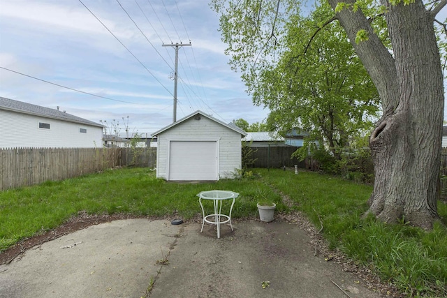 1116 Christyann St, Mishawaka, IN 46545 - view of yard with a patio area, an outbuilding, a fenced backyard, and a detached garage