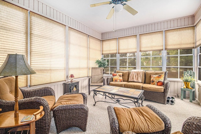 sunroom / solarium featuring ceiling fan, an outdoor hangout area, and plenty of natural light
