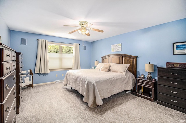 bedroom featuring carpet flooring, visible vents, baseboards, and ceiling fan