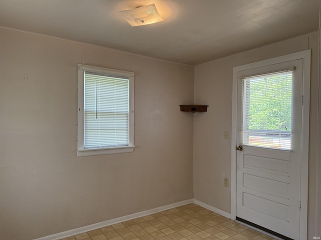 1406 E Hillside Dr, Bloomington, IN 47401 - doorway to outside featuring baseboards and light tile patterned flooring
