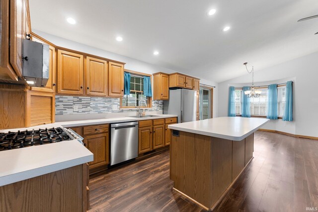 104 S Line St, South Whitley, IN 46787 - kitchen with a sink, lofted ceiling, freestanding refrigerator, dishwasher, and backsplash