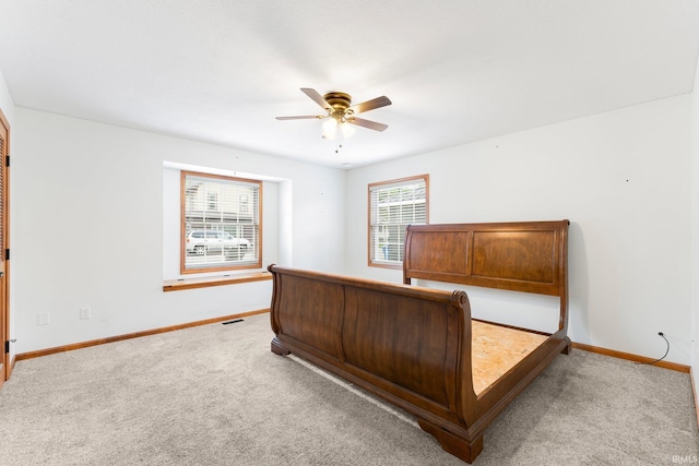 104 S Line St, South Whitley, IN 46787 - bedroom featuring carpet flooring, baseboards, and a ceiling fan
