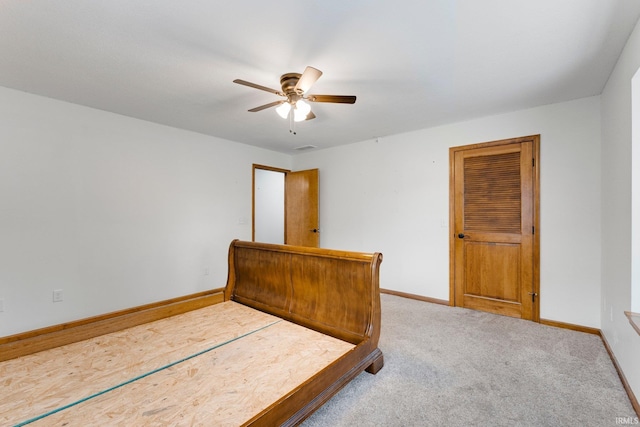 104 S Line St, South Whitley, IN 46787 - carpeted bedroom with baseboards, visible vents, and a ceiling fan