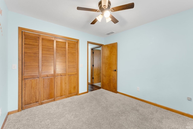 104 S Line St, South Whitley, IN 46787 - unfurnished bedroom with baseboards, carpet flooring, a closet, and visible vents